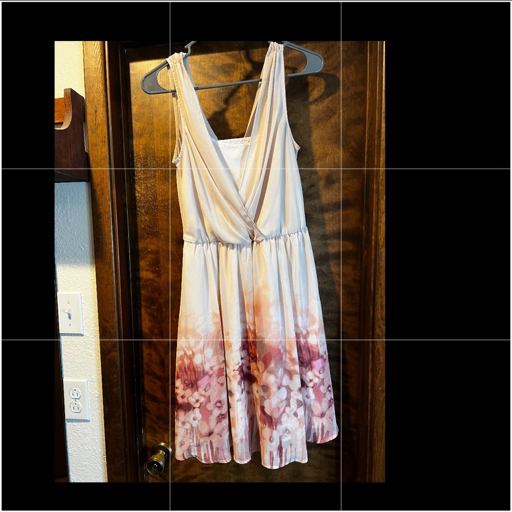 Size 4 Lauren Conrad dress. Peach overall color with floral design.
